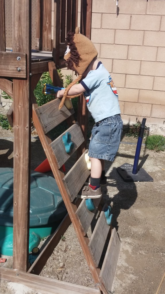 Tahoe climbs ladders a lot, but now as he climbs I help him hear the "L" sound in ladder. (Yes, my grands love wearing silly hats when they play.)