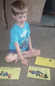 Kona used toys and a real quarter to match the words with their meanings.