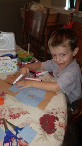 After gluing together his "building," Tahoe decided his project needed more colors.