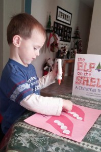 I had Tahoe glue paper circles to each elf cap to match the number I had written under each hat.